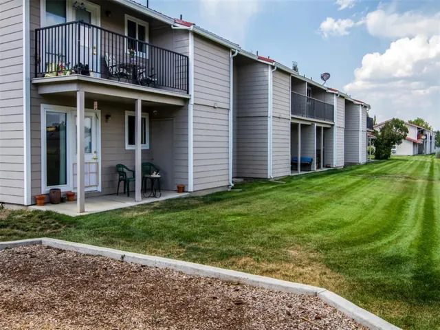 a brick house with a yard