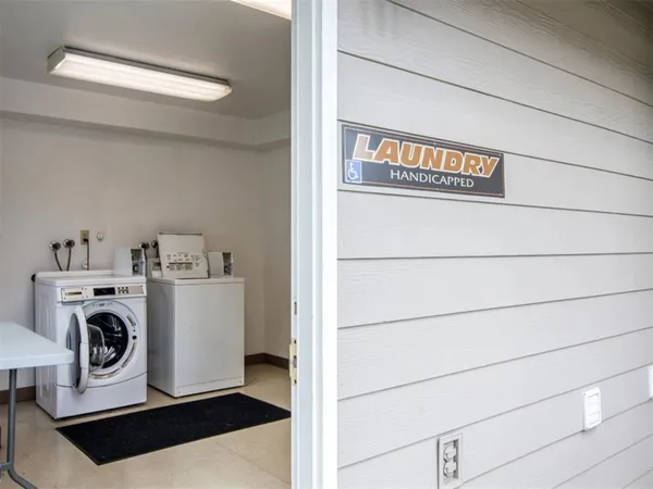 a view of storage and utility room with washer and dryer