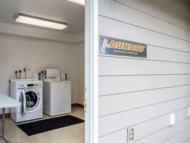 a view of storage and utility room with washer and dryer