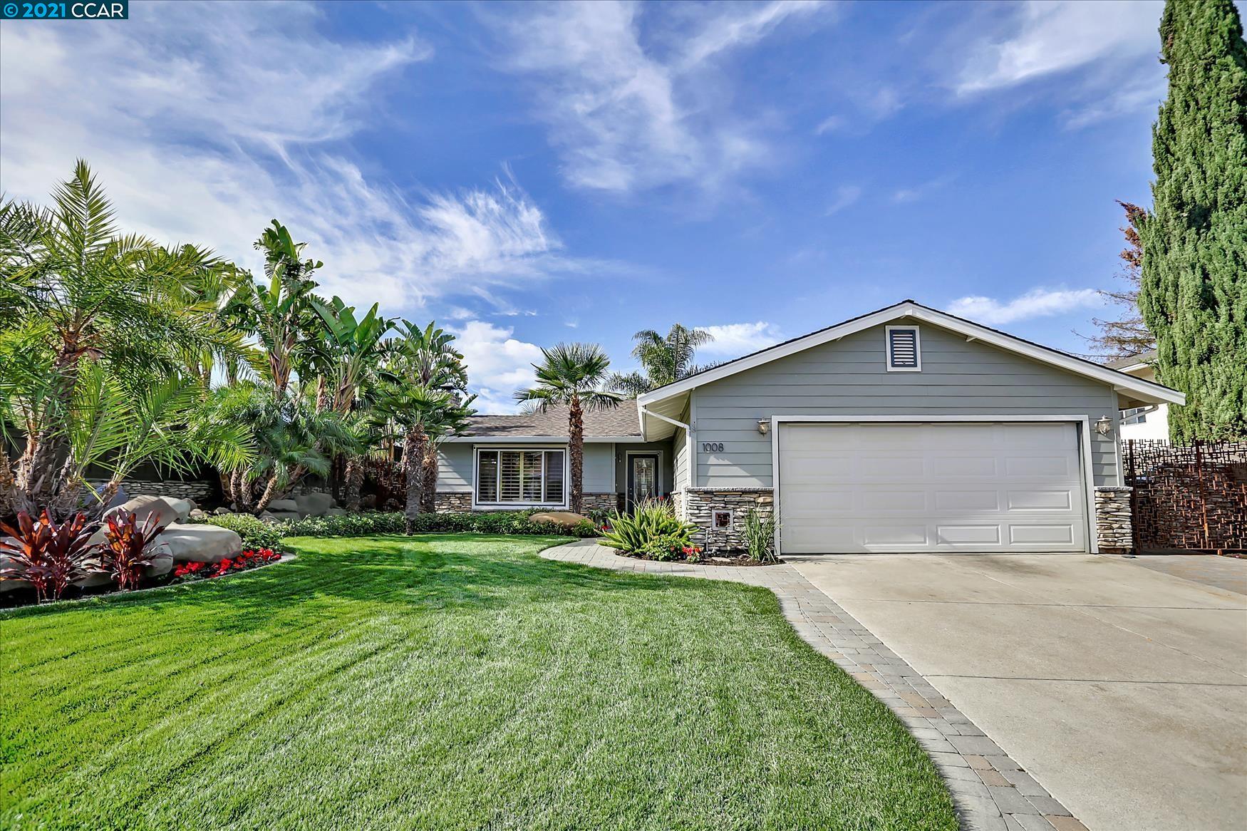1008 California Street Rodeo, CA 94572 - Photo 1 of 1 a front view of a house with garden