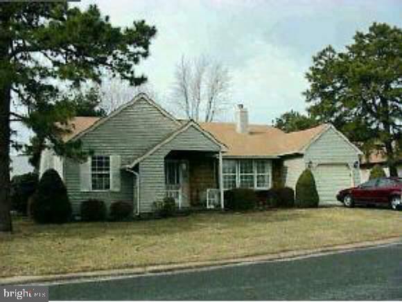 12 Ashley Road Manchester Township, NJ 08759 - Photo 1 of 1 a front view of a house with a garden