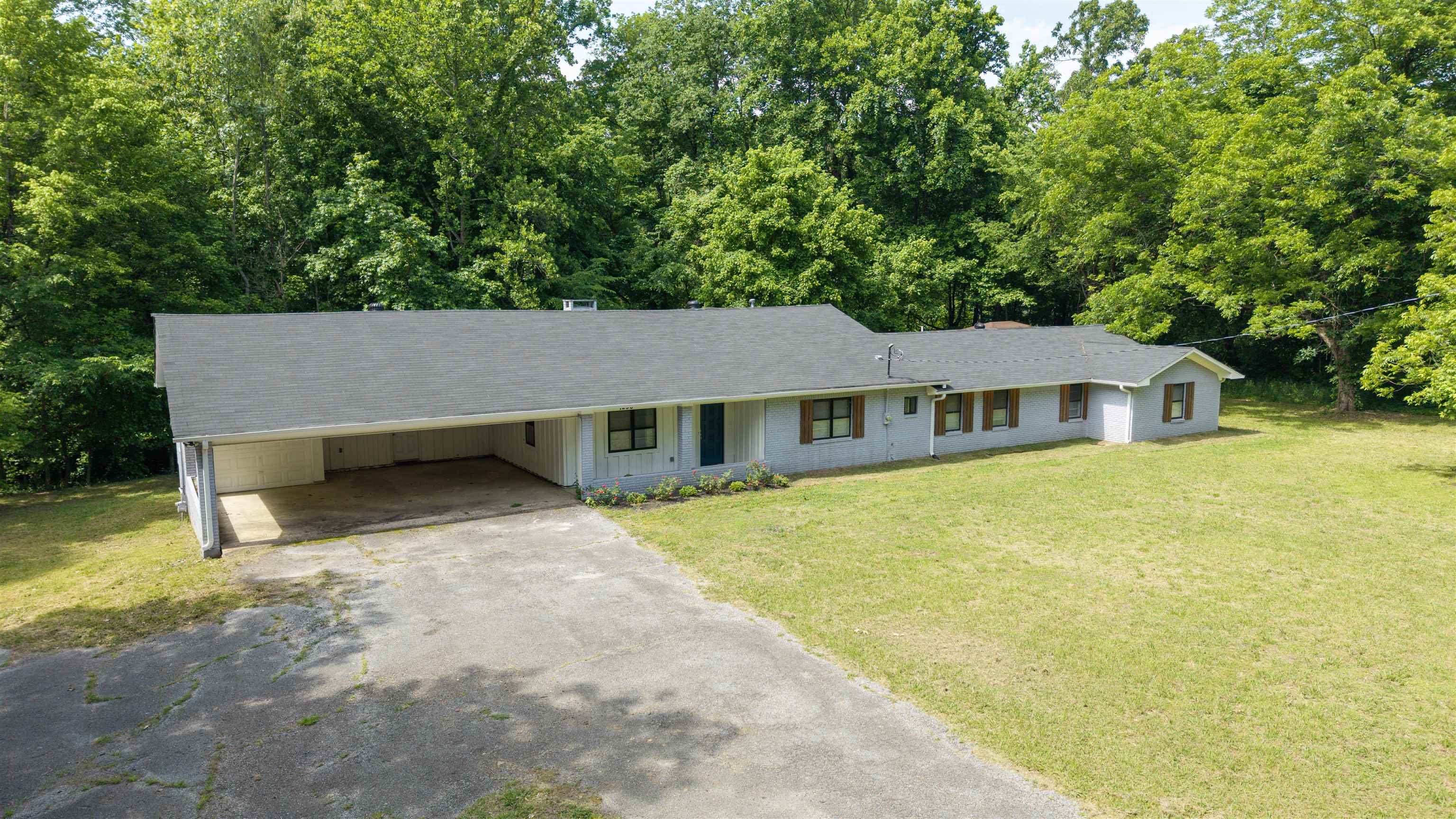 1296 Monasco Road Millington, TN 38053 - Photo 2 of 32 Ranch-style residence featuring a dark shingle roof and a light-colored exterior