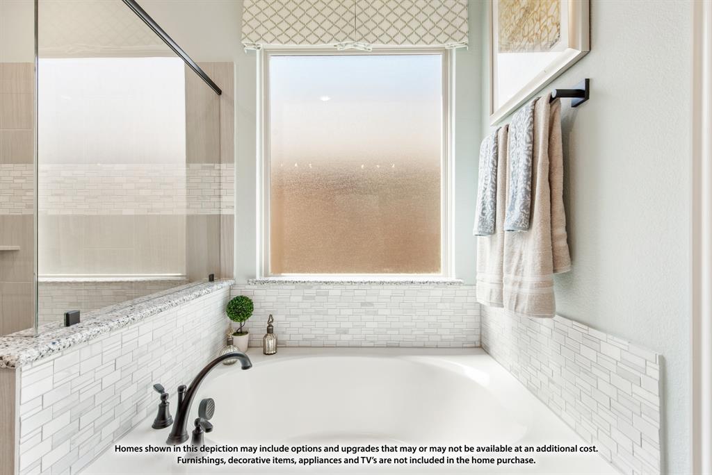 1106 Cardinal Drive Midlothian, TX 76065 - Photo 23 of 36 a bathroom with a tub and a shower