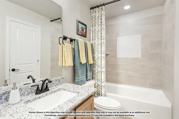 a bathroom with a granite countertop sink a mirror a bathtub and shower