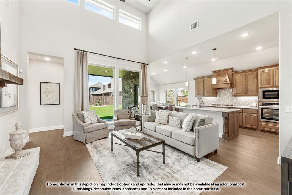 1106 Cardinal Drive Midlothian, TX 76065 - Photo 7 of 36 a living room with stainless steel appliances furniture and a rug