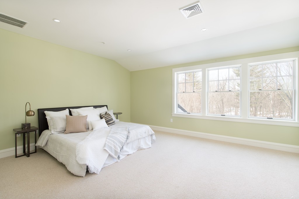 8 Abbey Road, Unit 8 South Walpole, MA 02071 - Photo 7 of 11 a bed room with a bed and a large window