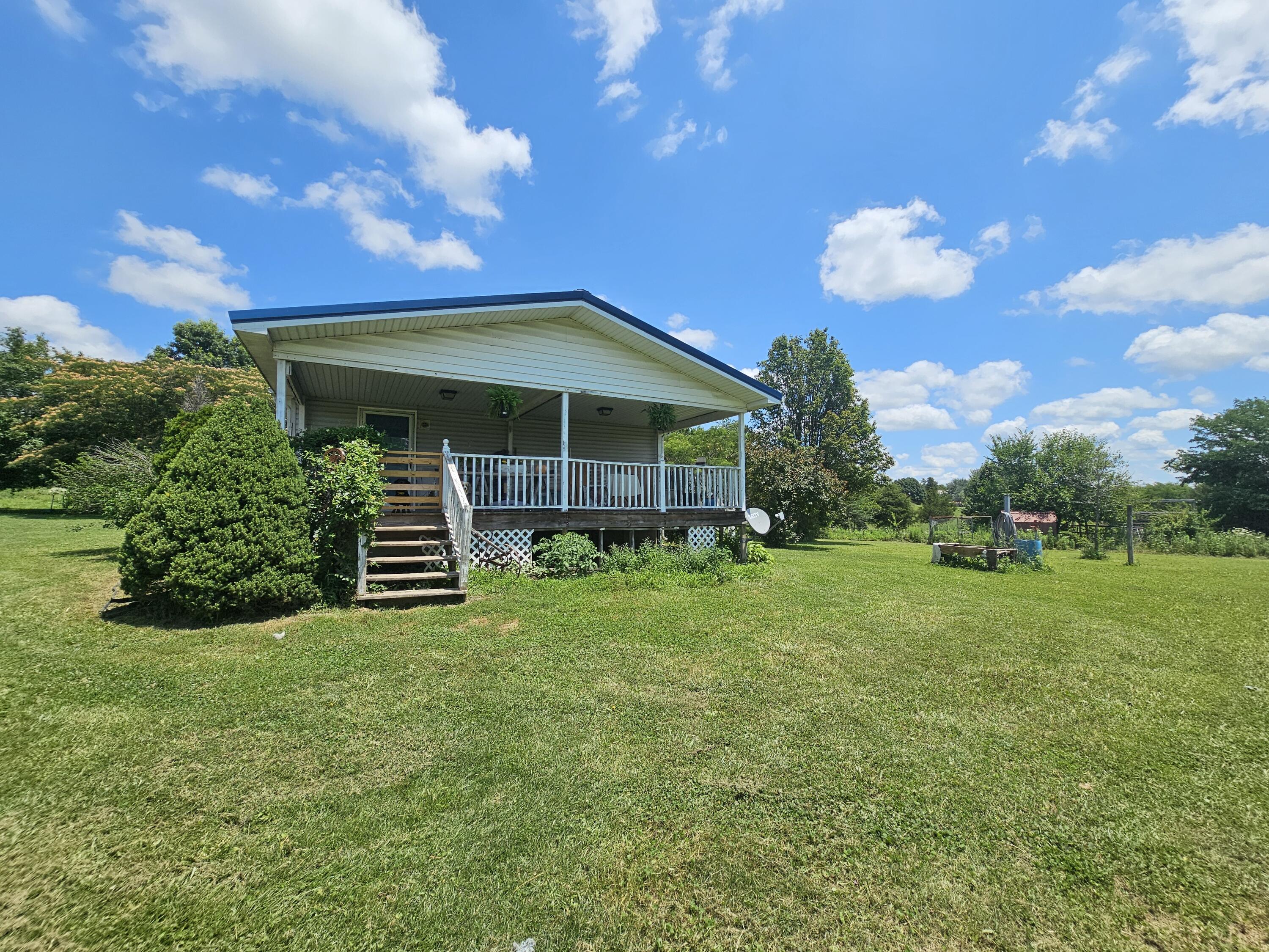 16868 Cedar Road Phillipsburg, MO 65722 - Photo 2 of 11 Back deck, overlooks acreage