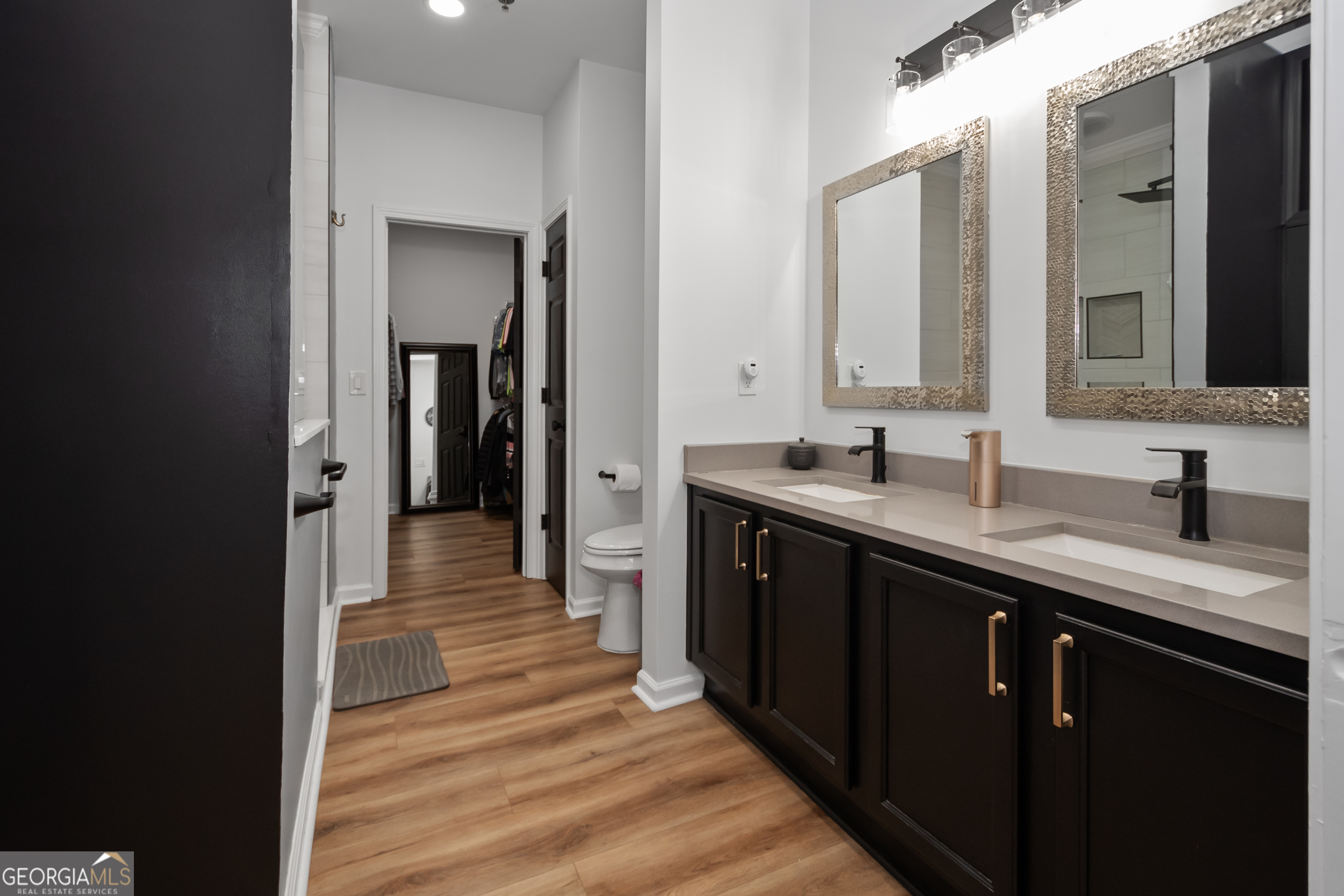 71 Thomaston Street Newnan, GA 30263 - Photo 23 of 38 a kitchen with a sink and a wooden floor