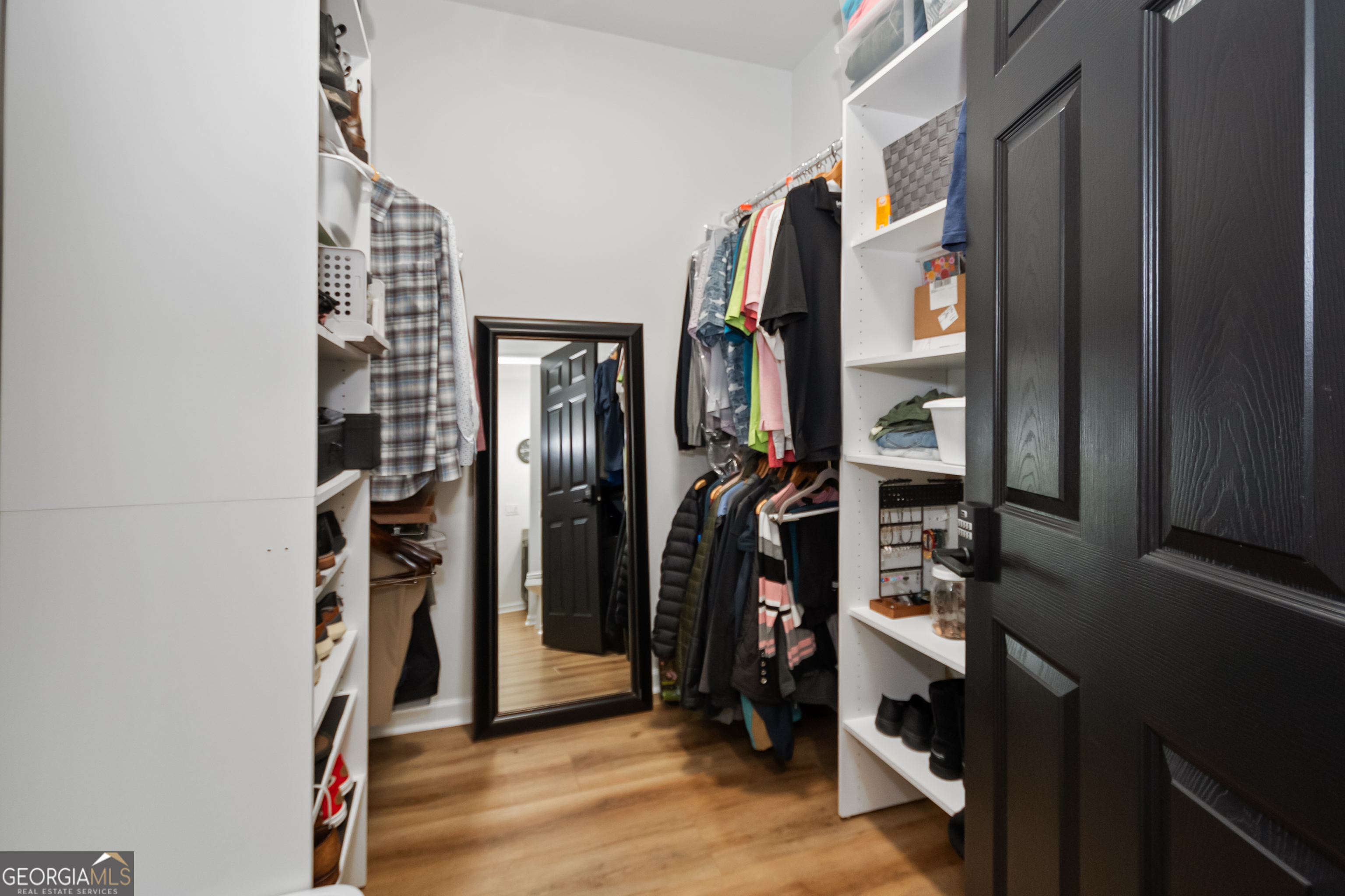 71 Thomaston Street Newnan, GA 30263 - Photo 26 of 38 a view of walk in closet with clothes