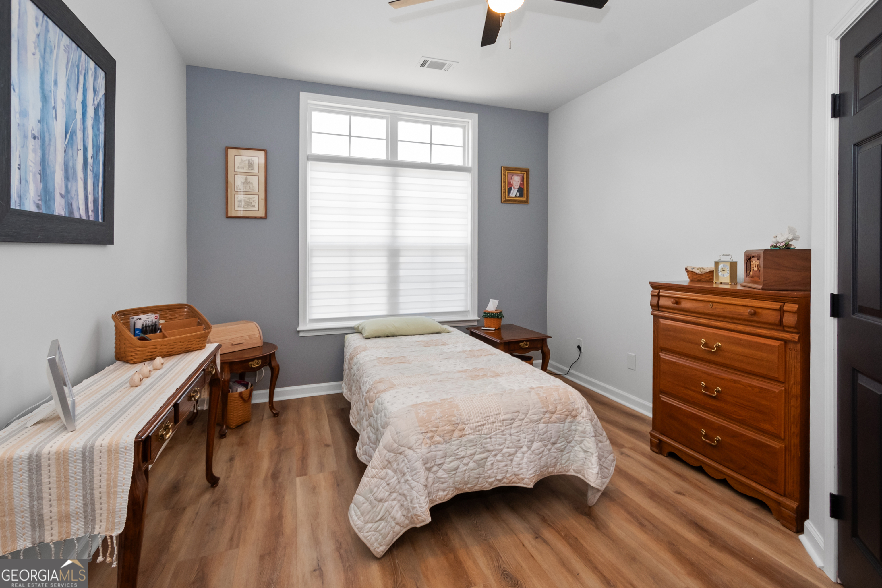 71 Thomaston Street Newnan, GA 30263 - Photo 28 of 38 a bedroom with a bed and a window