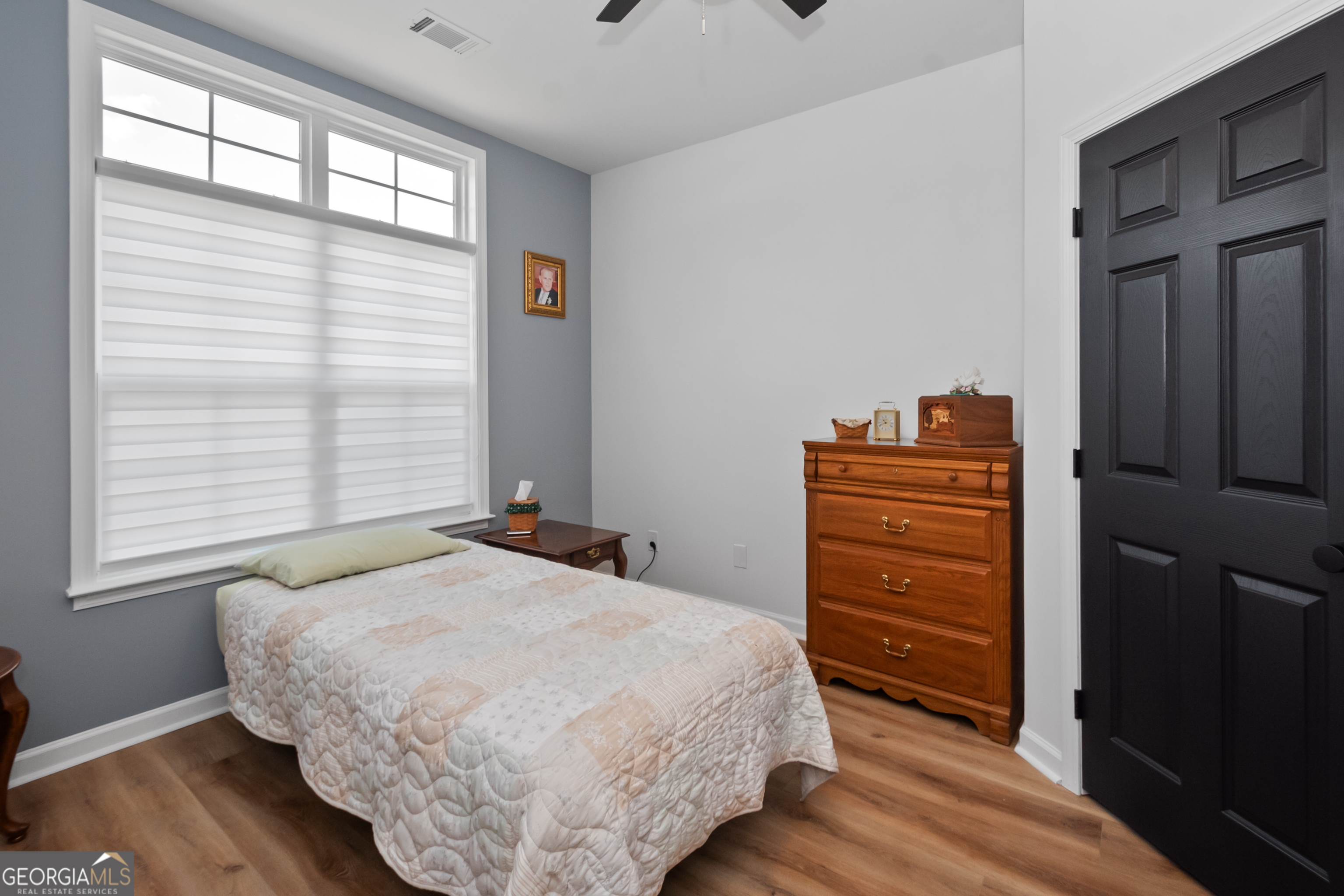 71 Thomaston Street Newnan, GA 30263 - Photo 29 of 38 a bedroom with a bed and a window