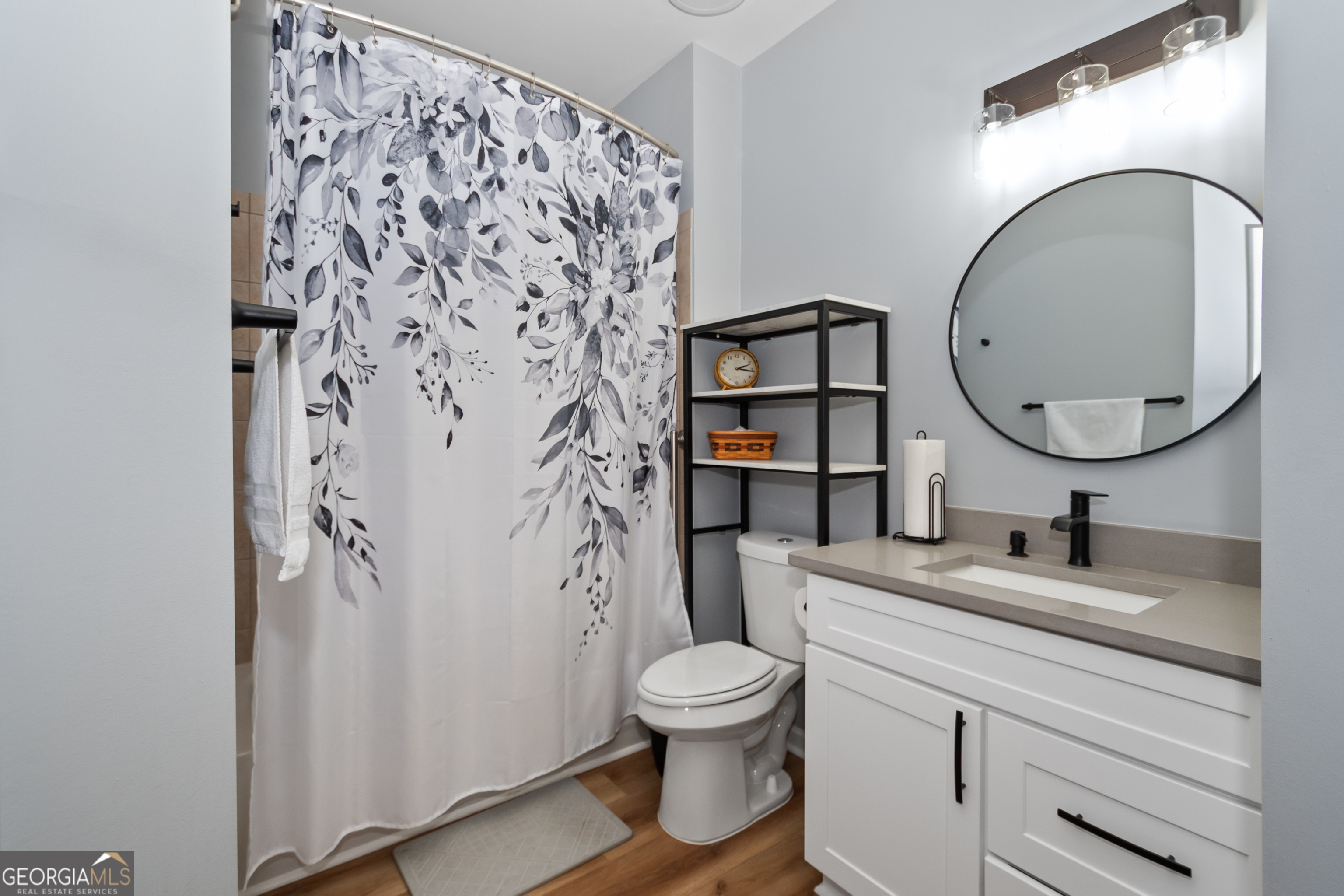 71 Thomaston Street Newnan, GA 30263 - Photo 32 of 38 a bathroom with a toilet sink vanity granite and shower