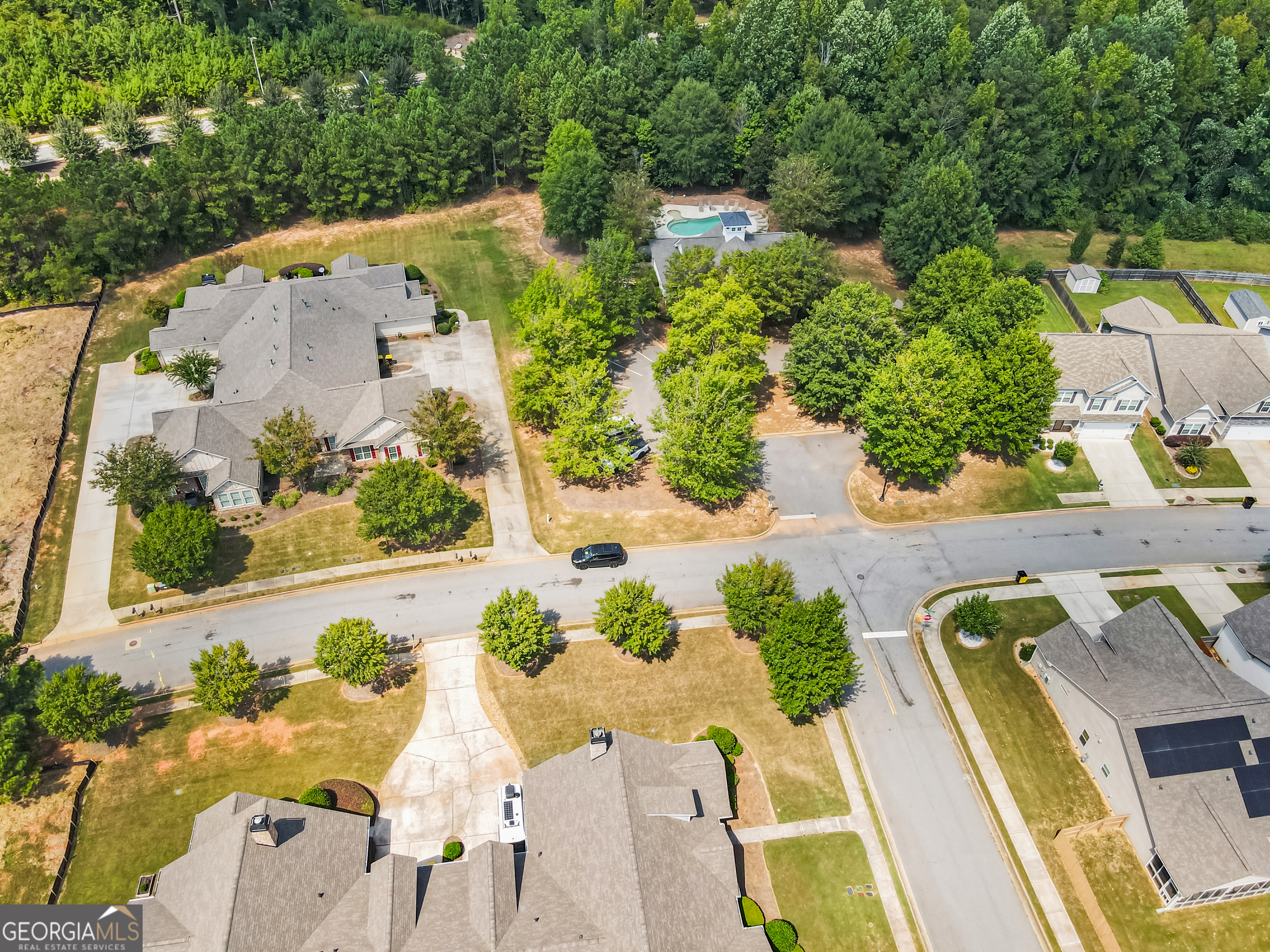 71 Thomaston Street Newnan, GA 30263 - Photo 37 of 38 an aerial view of a house with a swimming pool