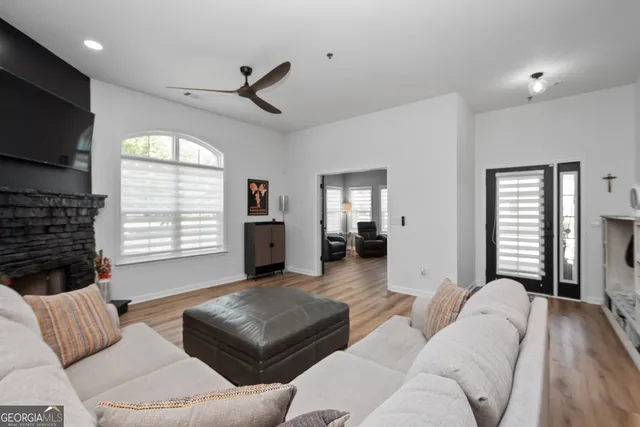a living room with furniture and a flat screen tv