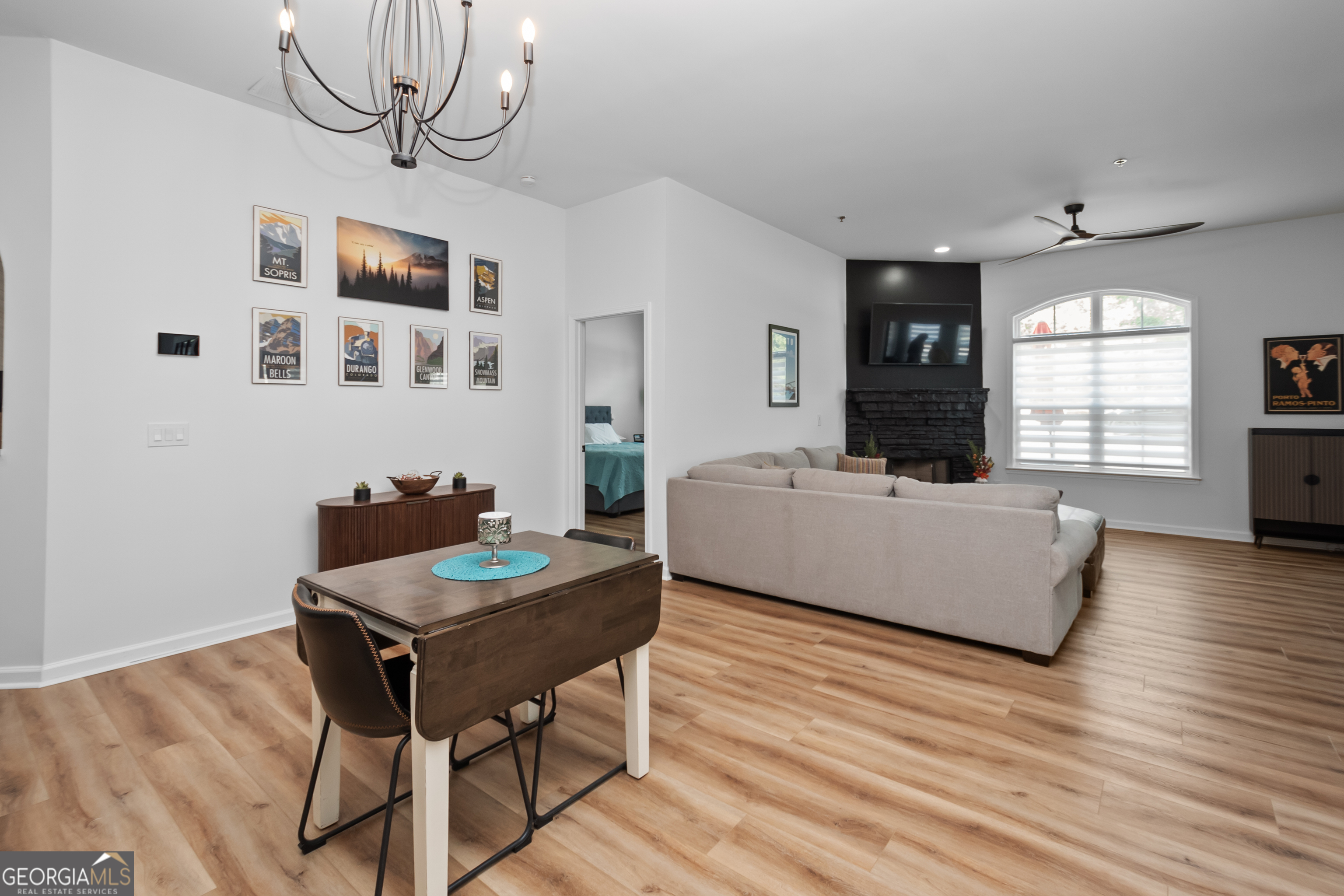 71 Thomaston Street Newnan, GA 30263 - Photo 7 of 38 a living room with furniture and a wooden floor