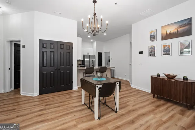 a view of a livingroom with furniture and wooden floor