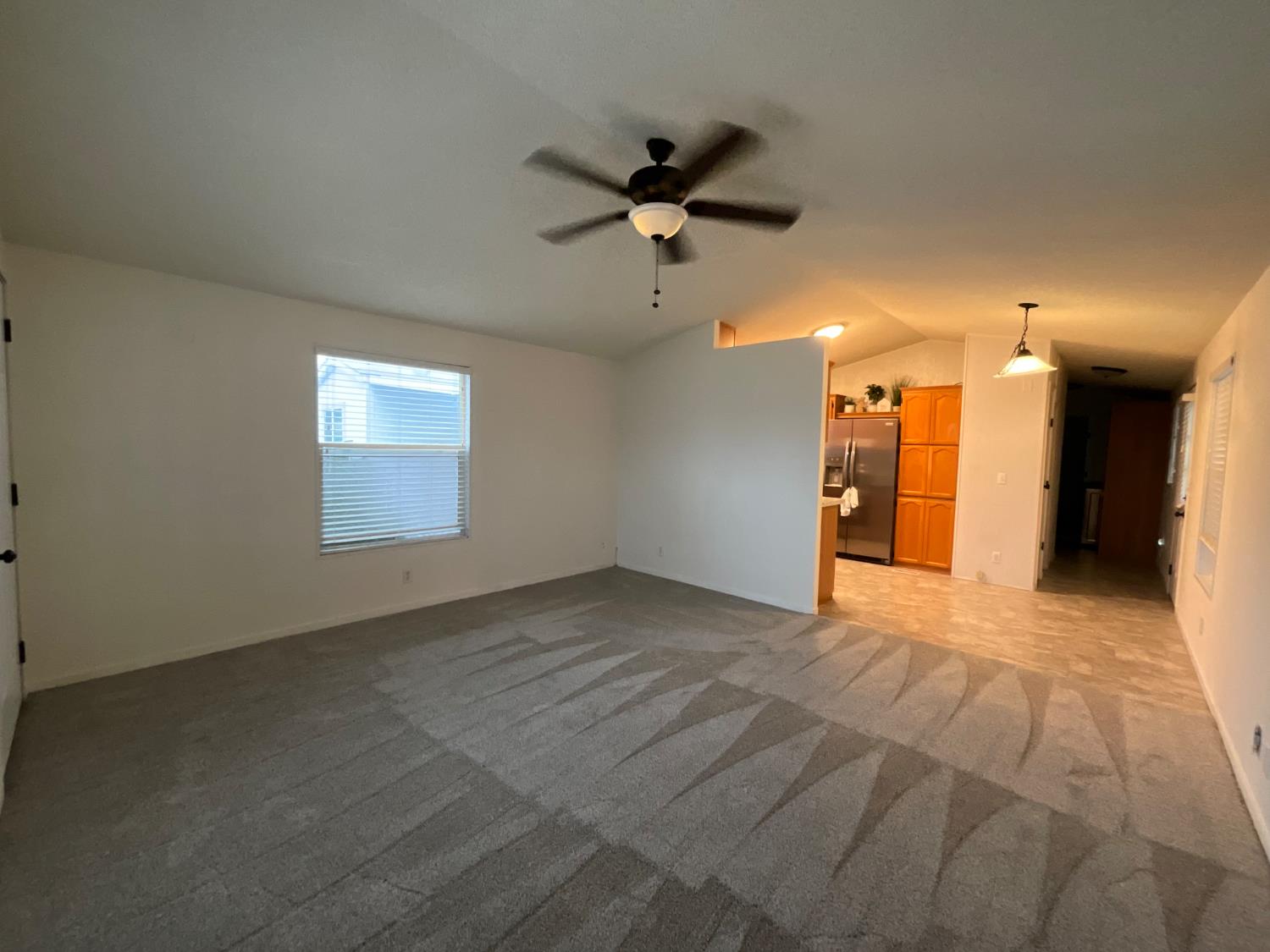 26 Golden Inn Way Rancho Cordova, CA 95670 - Photo 14 of 27 a view of a livingroom with a ceiling fan and window
