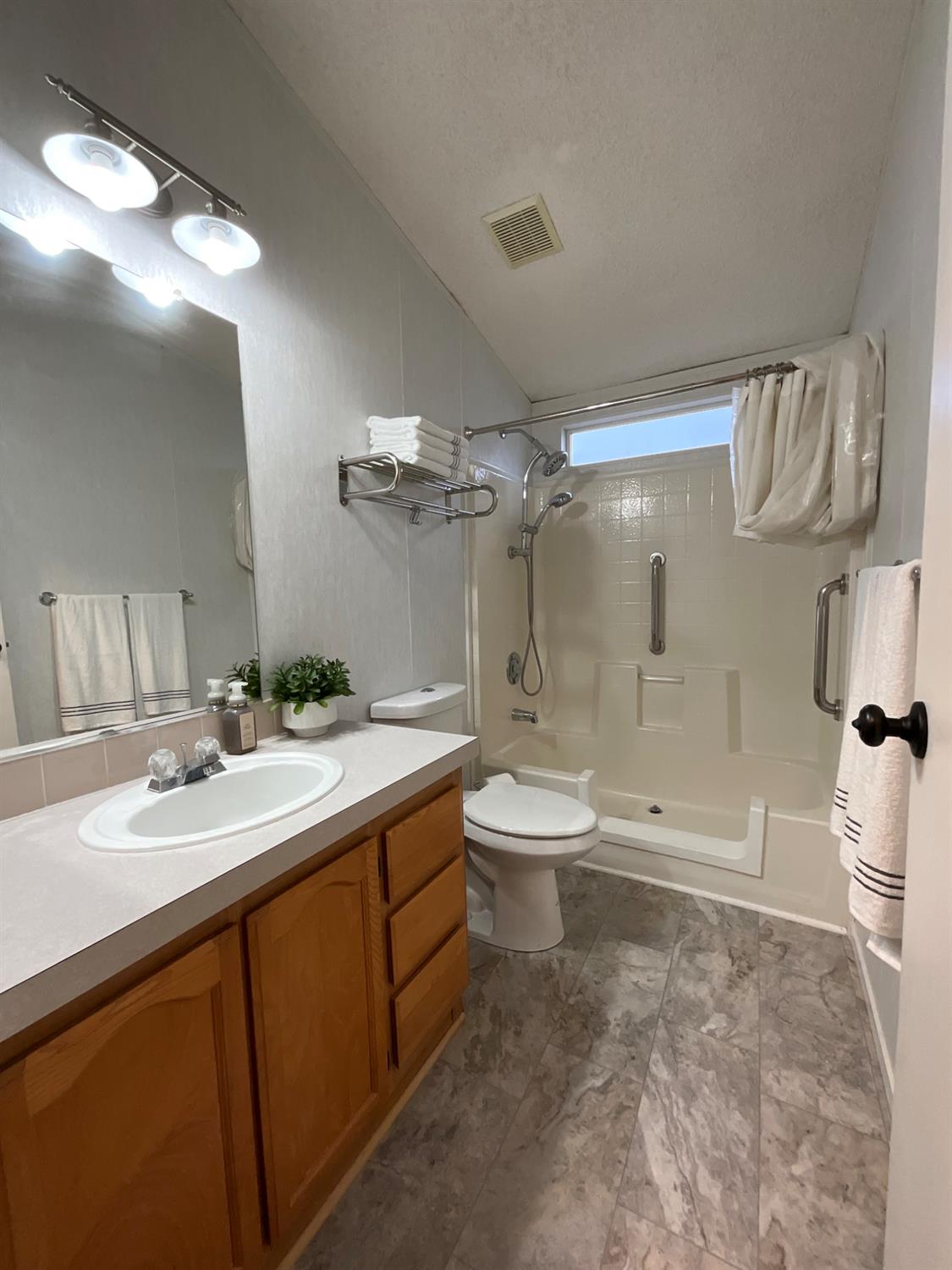 26 Golden Inn Way Rancho Cordova, CA 95670 - Photo 22 of 27 a bathroom with a sink a toilet and shower