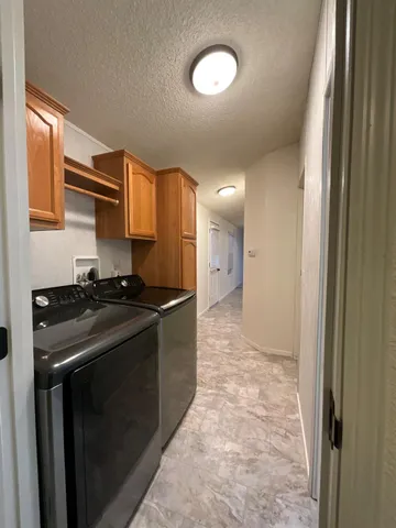 a kitchen with a sink stove and refrigerator