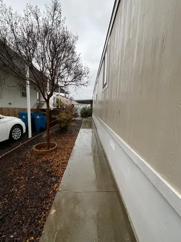 a view of a balcony with yard