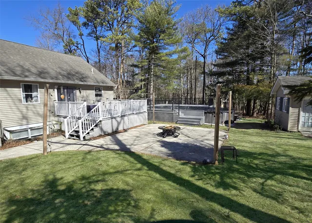 a view of a patio with table and chairs and potted plants