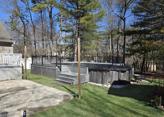 a view of yard with patio