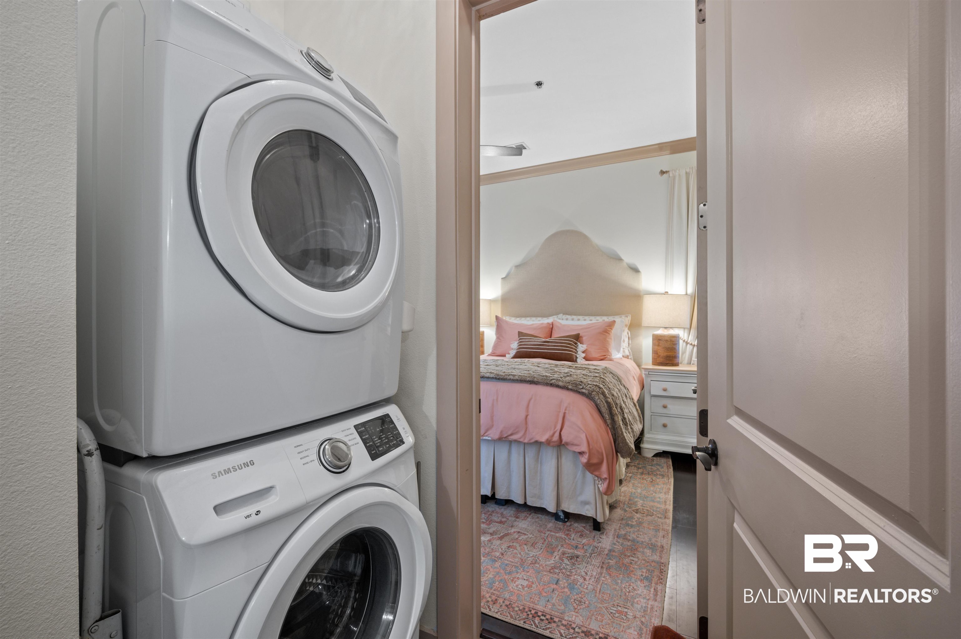 1430 Regency Road, Unit B202 Gulf Shores, AL 36542 - Photo 18 of 33 Laundry area with stacked washer / dryer and laundry area