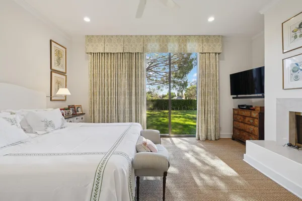 a bed room with a bed and a television