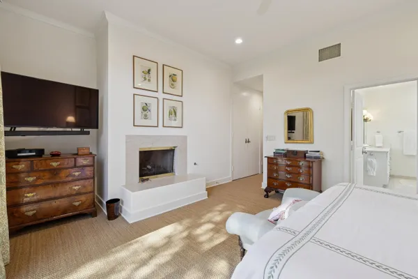a bedroom with furniture and a flat screen tv