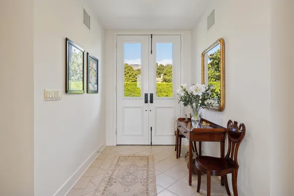 a view of a livingroom with furniture and a window