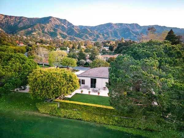 a view of a house with a big yard