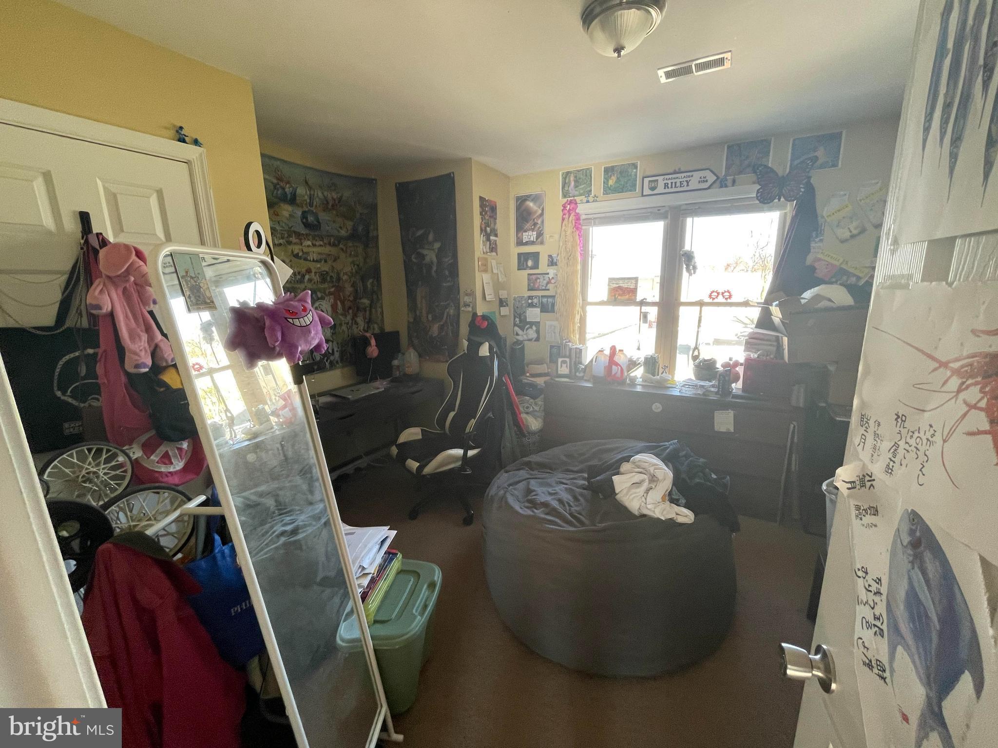1618 Page Street, Unit B Philadelphia, PA 19121 - Photo 13 of 17 a living room with furniture and a fireplace