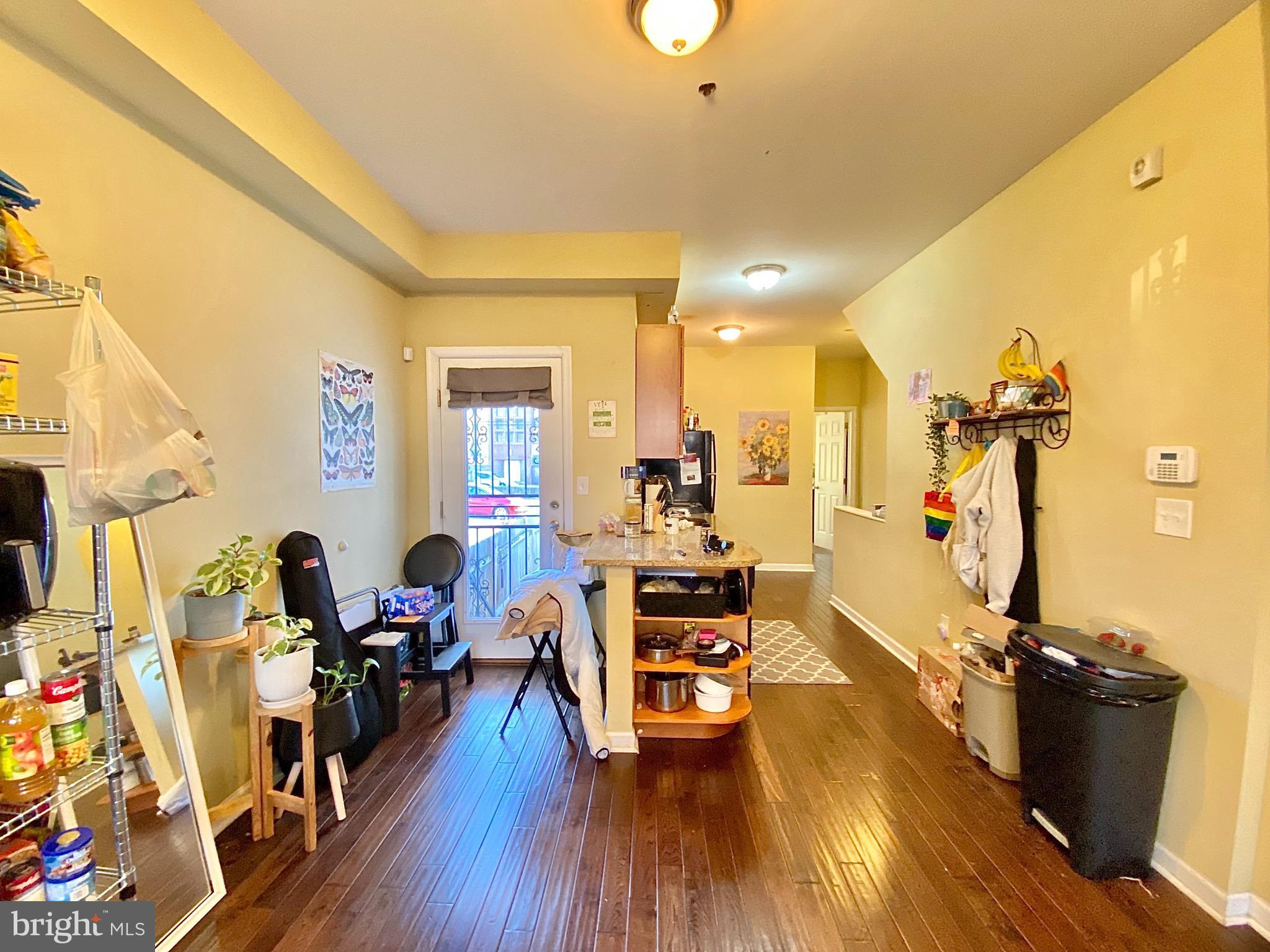 1618 Page Street, Unit B Philadelphia, PA 19121 - Photo 5 of 17 a living room with furniture and a wooden floor