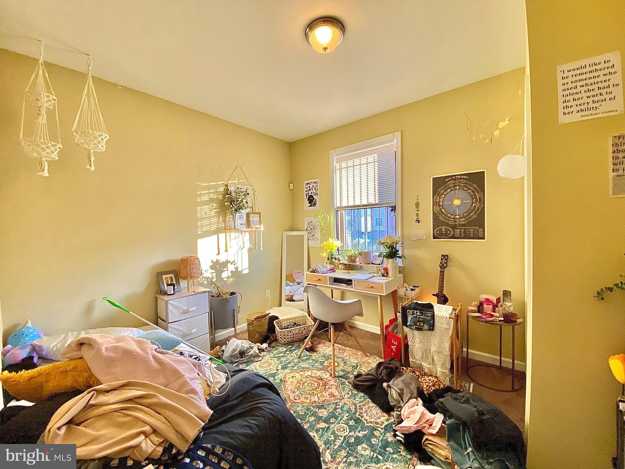 1618 Page Street, Unit B Philadelphia, PA 19121 - Photo 8 of 17 a bed room with a bed and a couch