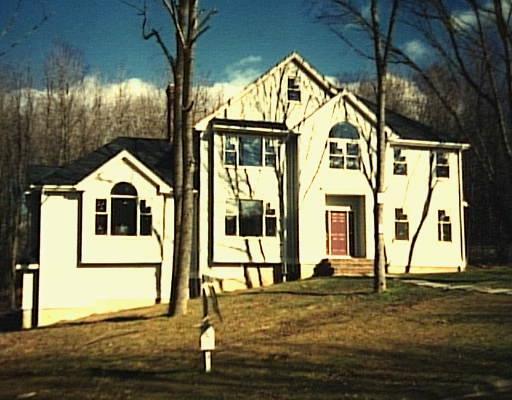 18 Mountain Manor Road Newtown, CT 06482 - Photo 1 of 1 a front view of a house with garden