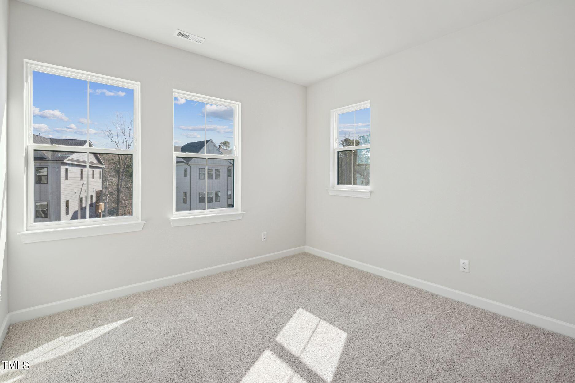 4717 Cypress Tree Lane Raleigh, NC 27612 - Photo 3 of 11 Elm Park 59_Bedroom 1_2.3.25_webready