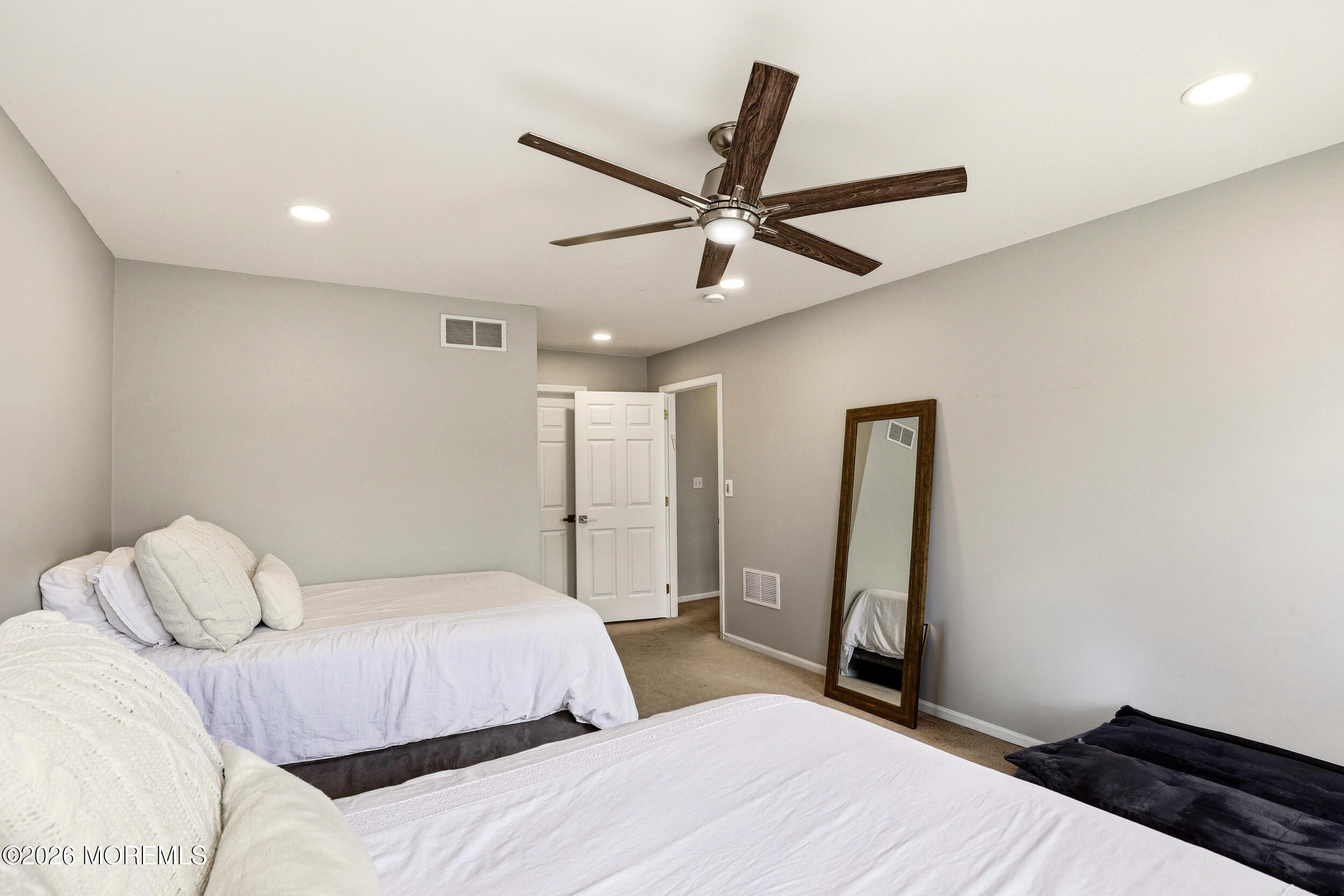 2055 MacKenzie Road Toms River, NJ 08755 - Photo 24 of 56 a bedroom with a bed and a ceiling fan