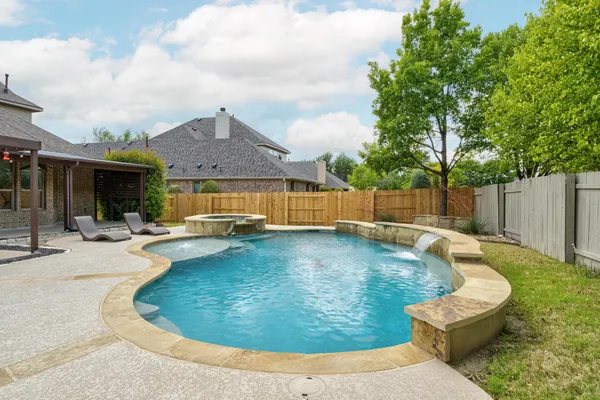 a view of swimming pool with seating space