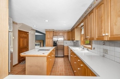 15 Shore Road Saugus, MA 01906 - Photo 5 of 15 a kitchen with a sink a counter top space and stainless steel appliances