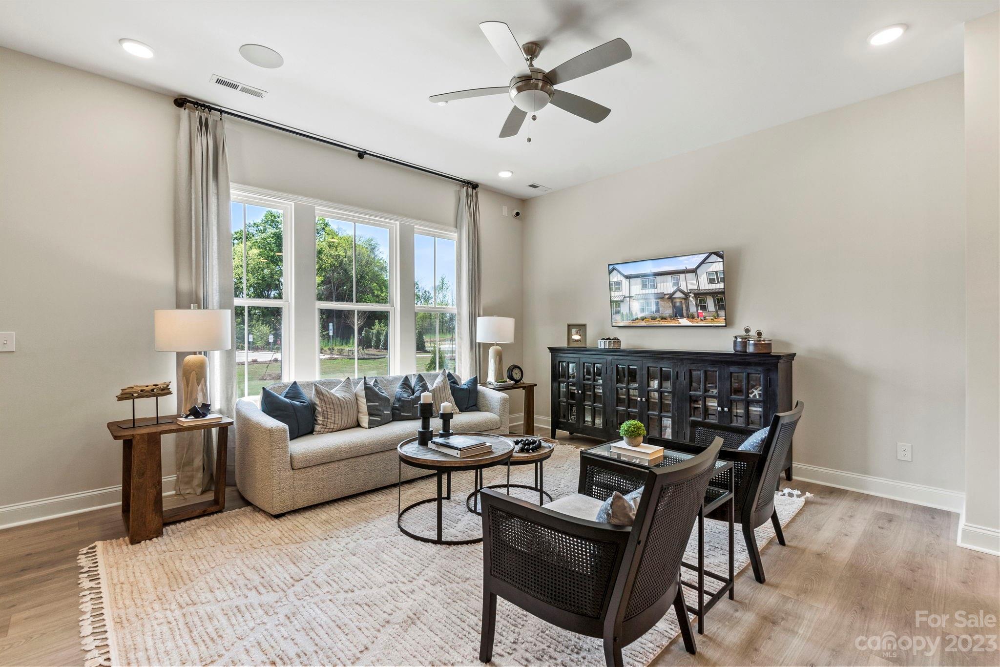 8958 Morning Mist Road Harrisburg, NC 28215 - Photo 11 of 28 a living room with furniture and a large window