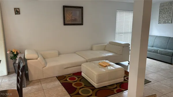 a living room with furniture and a couch