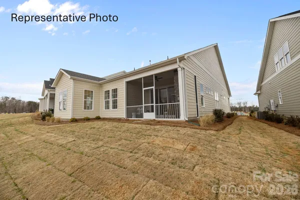 a view of a house with backyard
