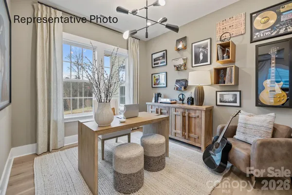 a work room with furniture and a window