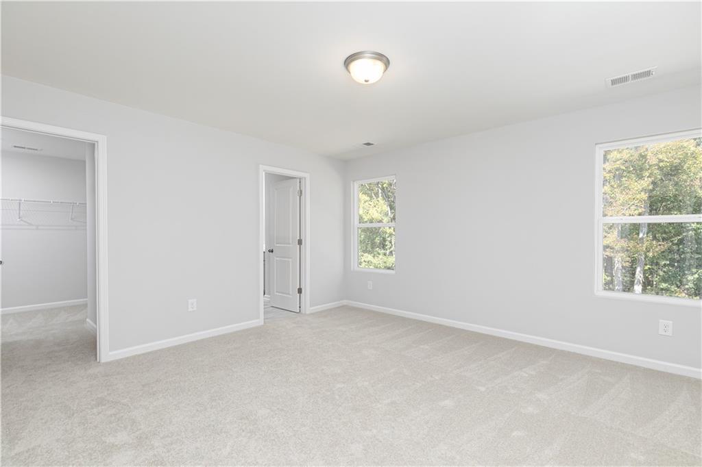 326 Cavalier Lane Acworth, GA 30102 - Photo 24 of 64 an empty room with windows and closet