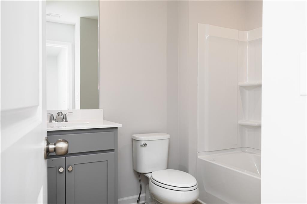 326 Cavalier Lane Acworth, GA 30102 - Photo 32 of 64 a bathroom with a toilet a sink and bathtub