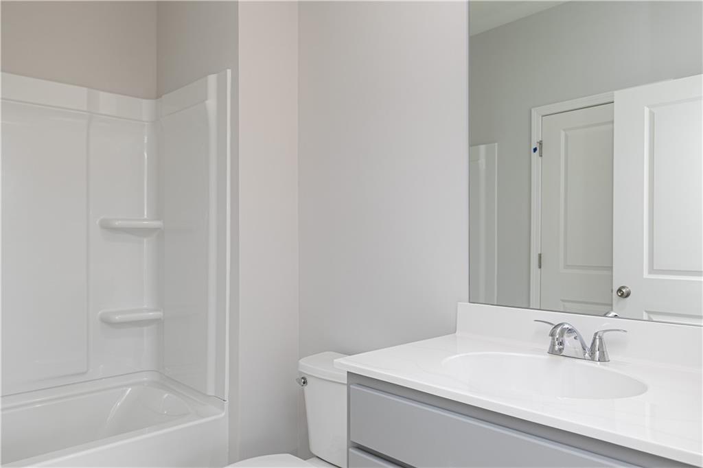 326 Cavalier Lane Acworth, GA 30102 - Photo 6 of 64 a bathroom with a sink toilet and vanity