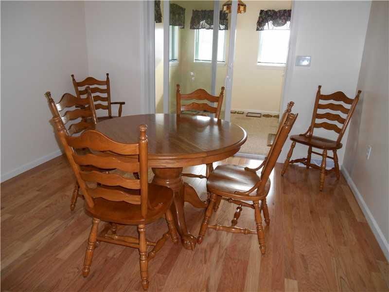 331 School Road Dawson, PA 15428 - Photo 8 of 25 Dining Room. The dining room leads to the enclosed computer/sun room.