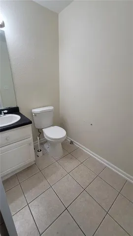 a bathroom with a sink toilet and a vanity