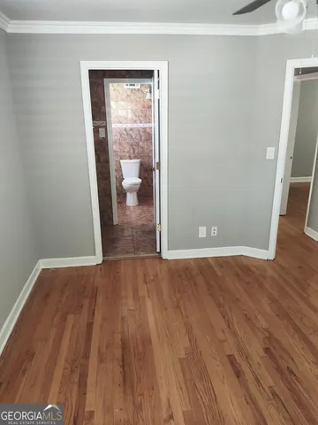 a bathroom with a toilet and a bathtub