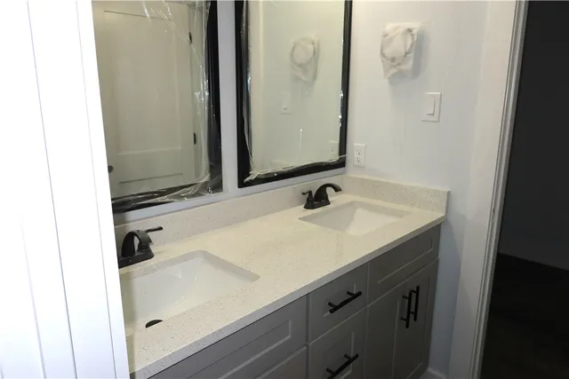 a kitchen with stainless steel appliances granite countertop a sink stove and wooden floor